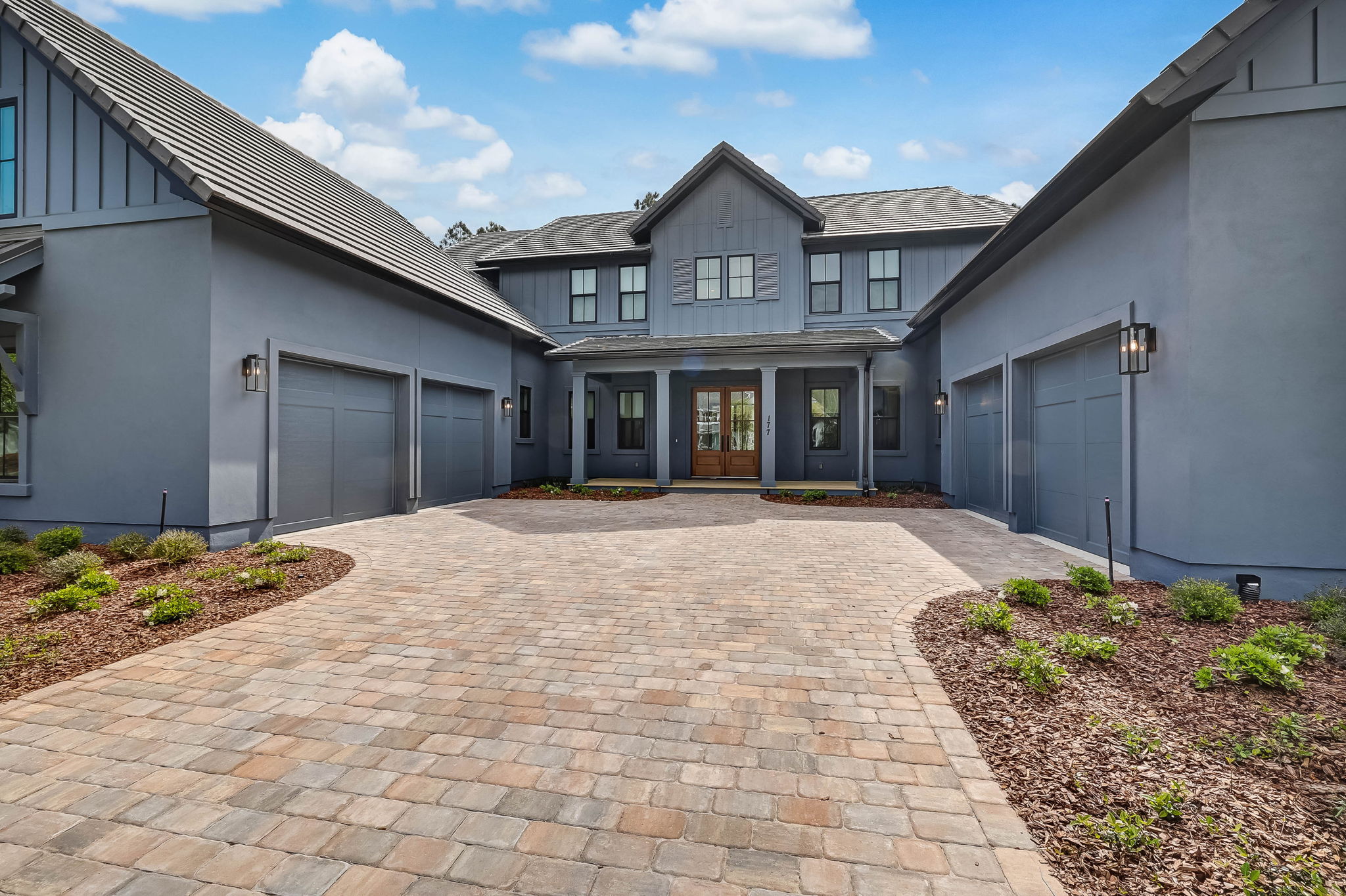 This new construction home in Nocatee, FL was built with the homeowners design specifications in mind. We just love the dark moody exterior paint color, don’t you? 