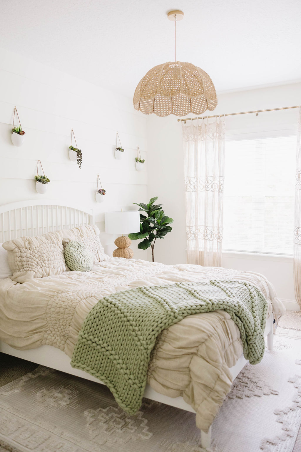 Bohemian style bedroom with a soft finishes, layered textures, and natural touches.