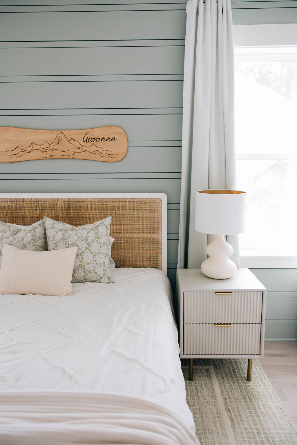 kid's room with custom wall treatment on the accent wall and elegant furnishings.