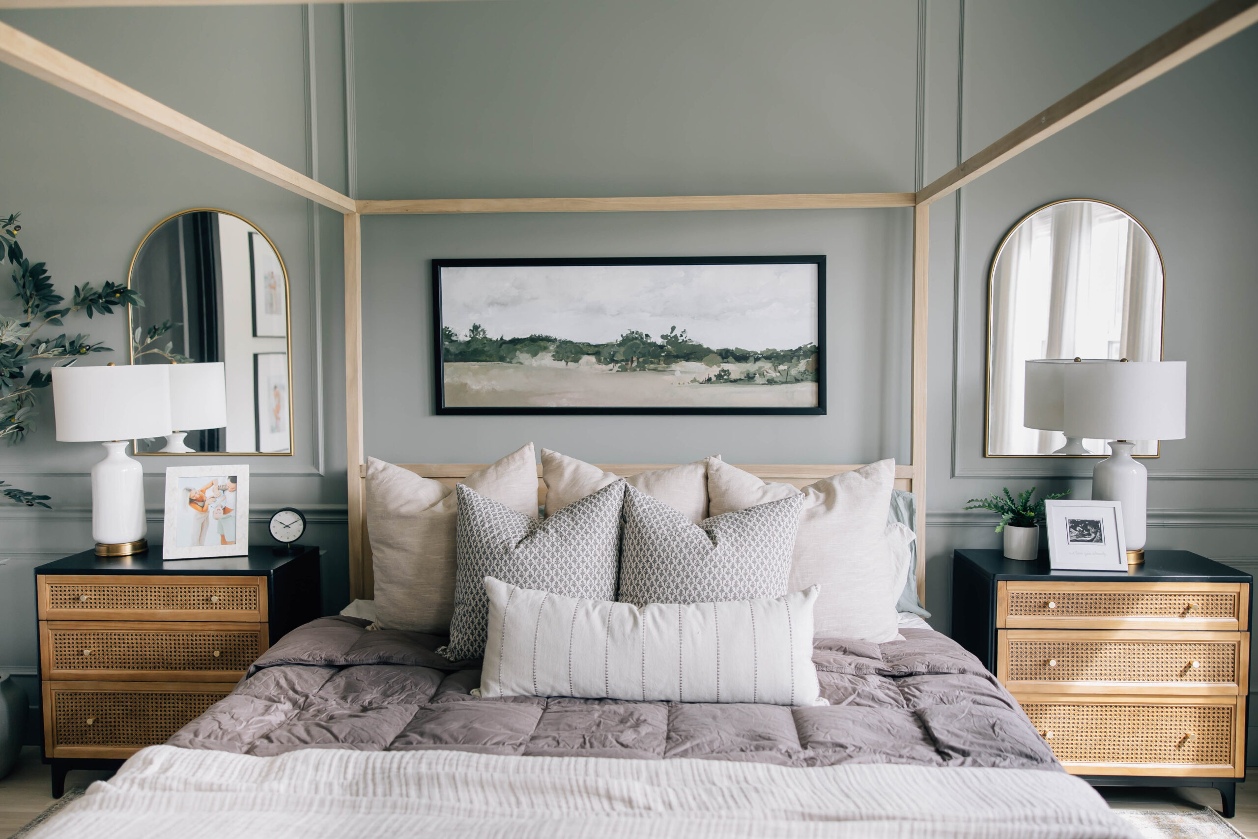 Luxurious primary bedroom with soft neutral tones, layered bedding, and custom accents styled by a Ponte Vedra interior designer
