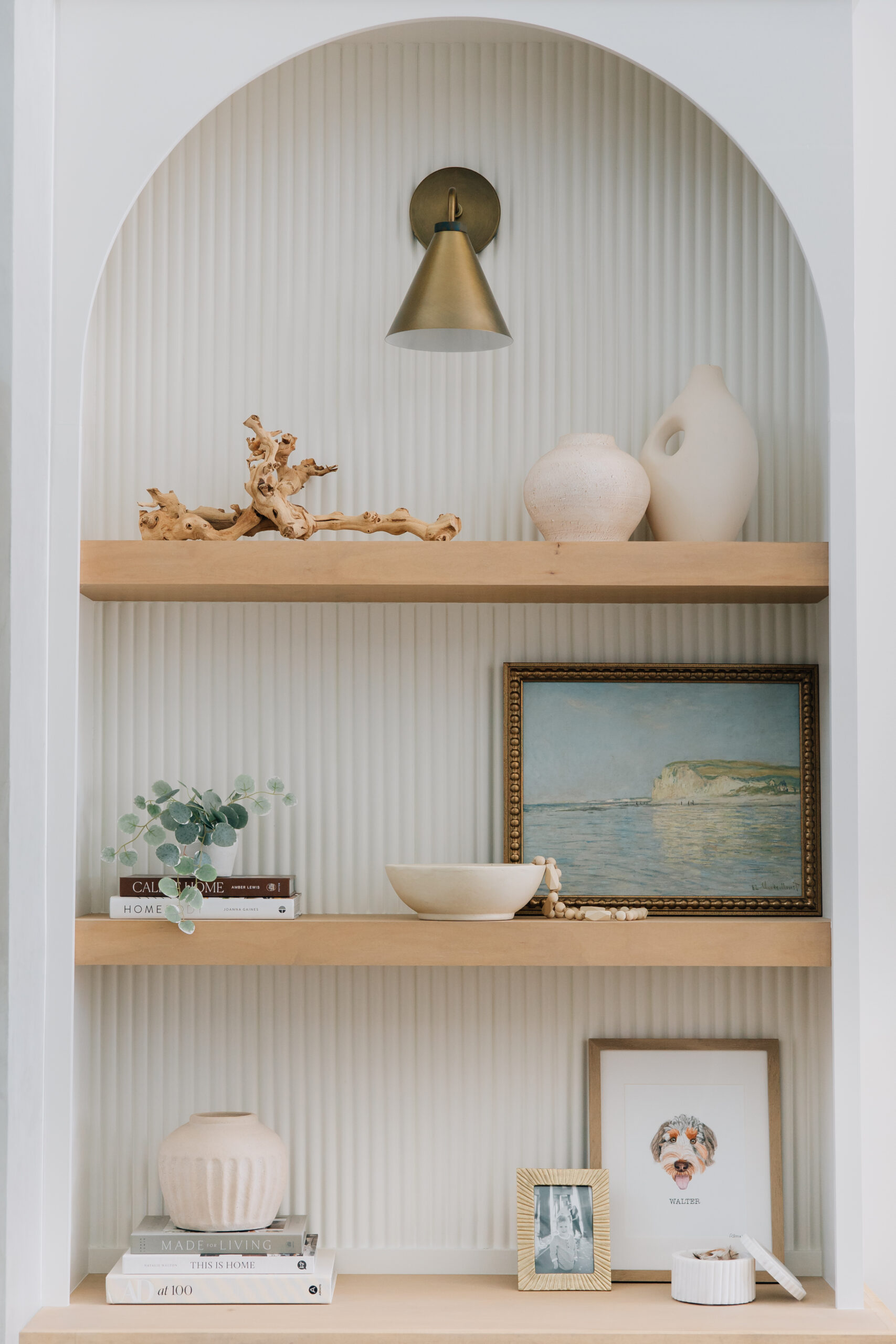 Custom built-ins frame the fireplace with intentional seasonal decor items.