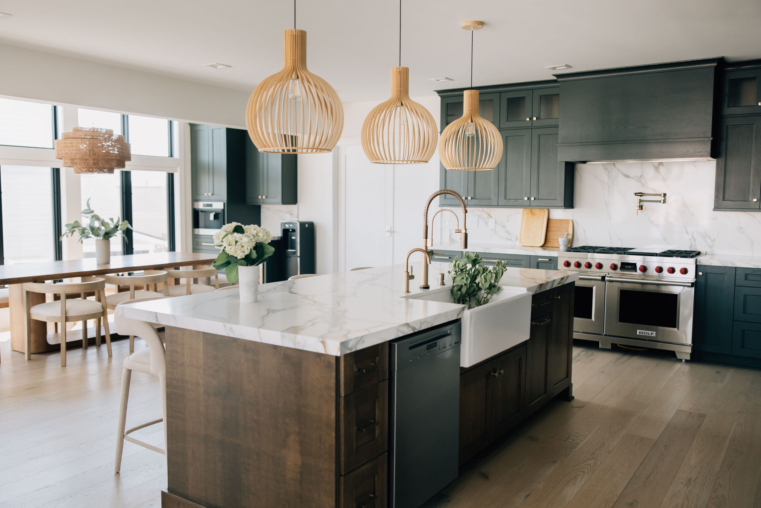 Coastal-inspired kitchen design with quartz island and wood pendants in a Ponte Vedra luxury home
