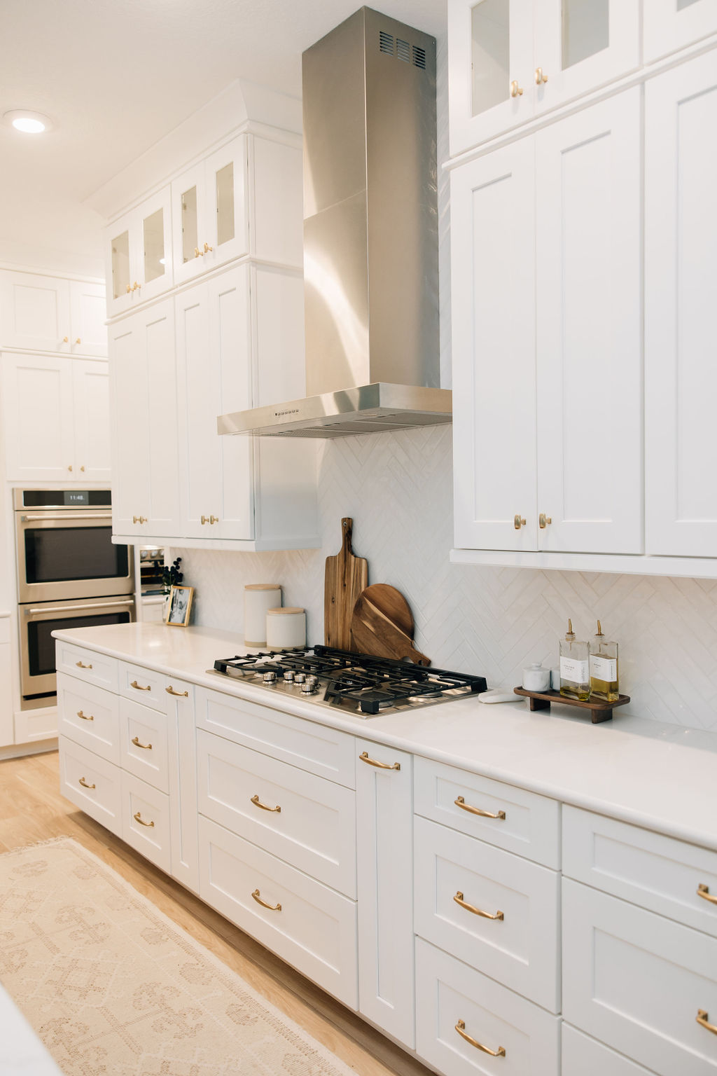 Well planned kitchen cabinets and layout designed to avoid common renovation mistakes and improve functionality in a full home renovation.