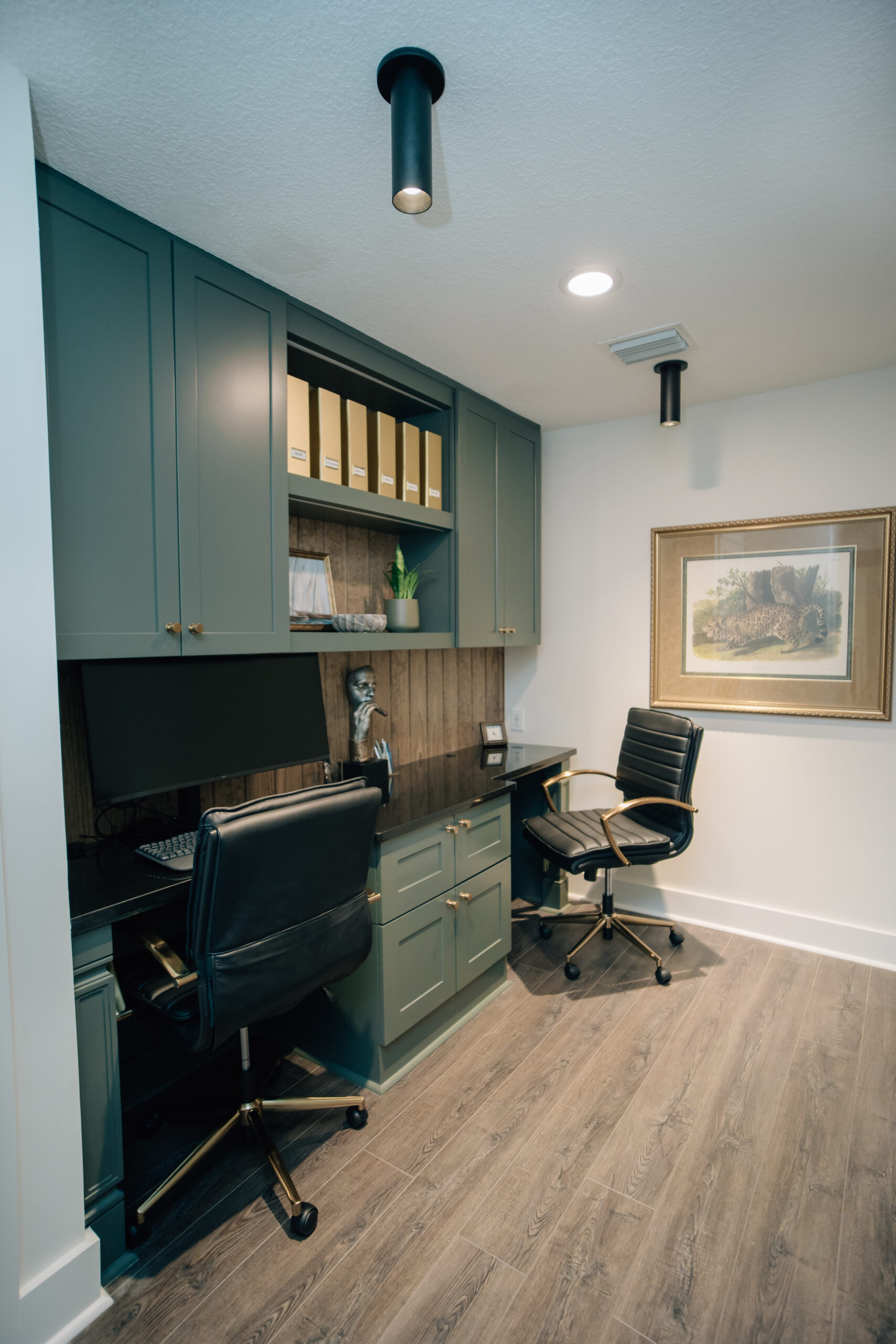 A home office with workspace for two people, with plenty of office storage, Work-friendly lighting, and efficient use of shared space